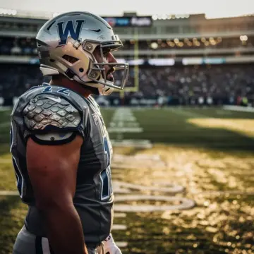 AJ Epenesa in Buffalo Bills uniform rushing the passer during an NFL regular season game