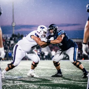 Buffalo Bills center Connor McGovern blocking for Josh Allen during an NFL game in 2025