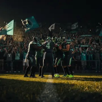 Los Angeles Chargers defensive lineman in a pass-rush stance during an NFL game, edge rusher free ag