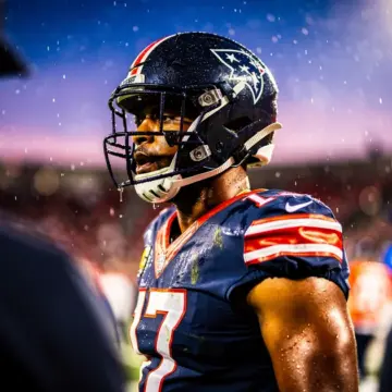 Dallas Cowboys helmet beside Las Vegas Raiders gear representing the Maxx Crosby trade pursuit in 2026